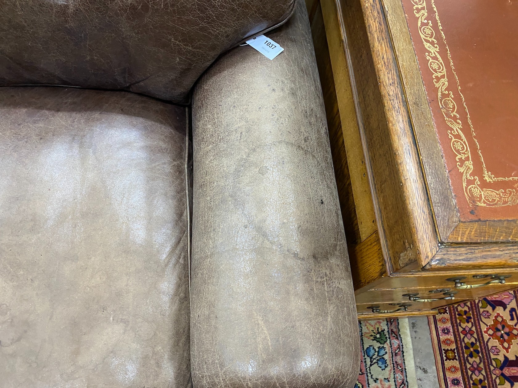 A Laura Ashley brown leather upholstered two seater settee, width 172cm